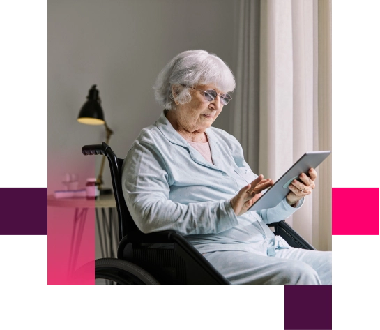 Woman using digital tablet while sitting on wheelchair