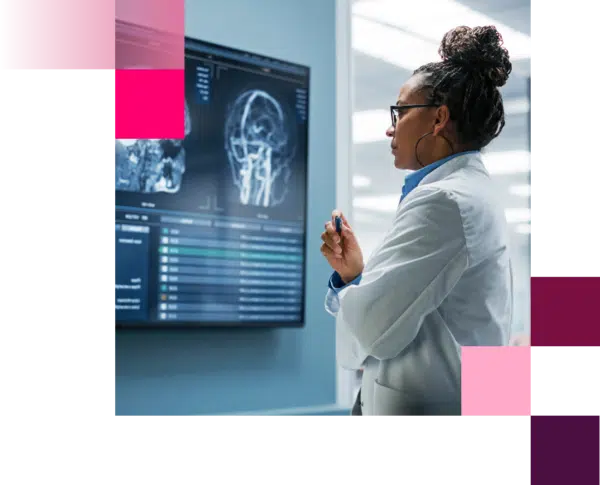Oncology scientist reviewing oncology imaging display